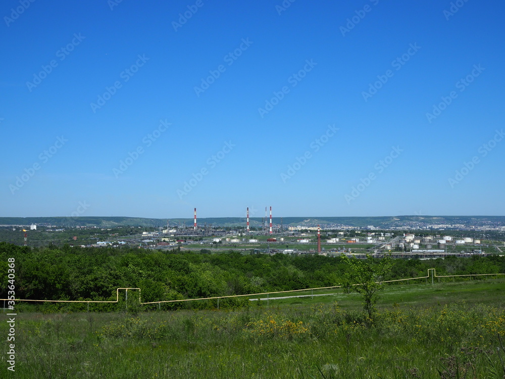 Oil refinery and petrochemical architecture plant industrial with blue sky background, White oil and gas refinery tank, Oil refinery plant from industry zone business power and energy petroleum. Oil refinery and petrochemical architecture plant industrial with blue sky background, White oil and gas refinery tank, Oil refinery plant from industry zone business power and energy petroleum.