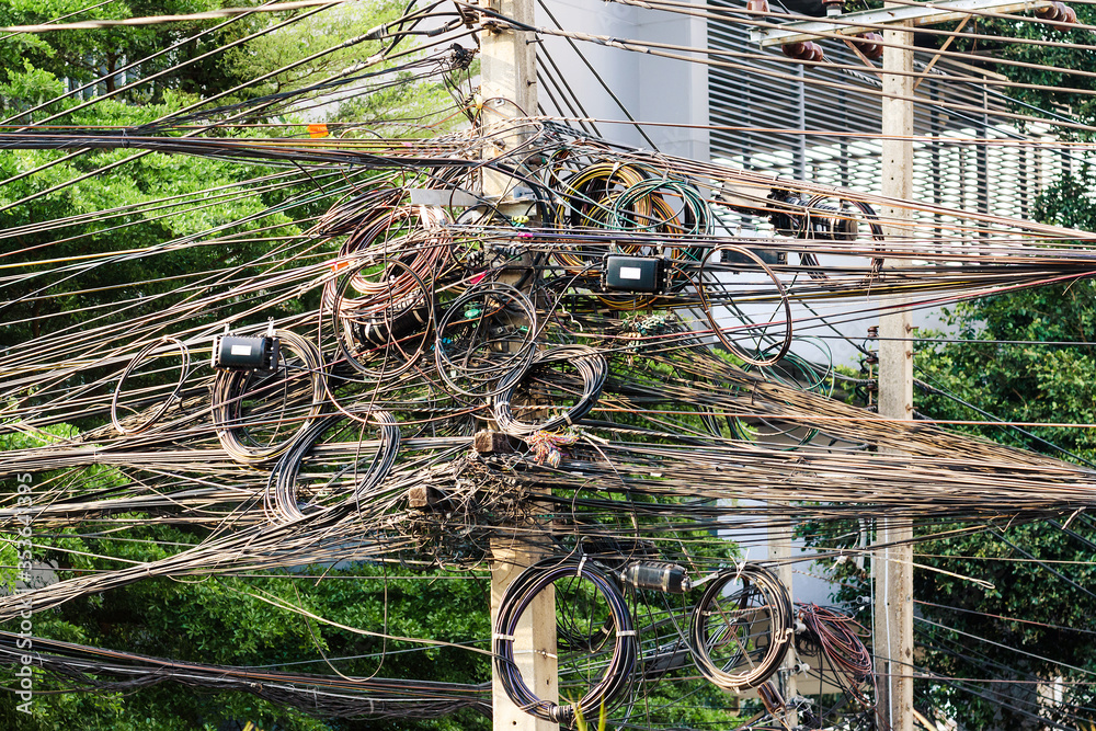 Utility pole with lots of entangled electrical wires, Chiang Mai