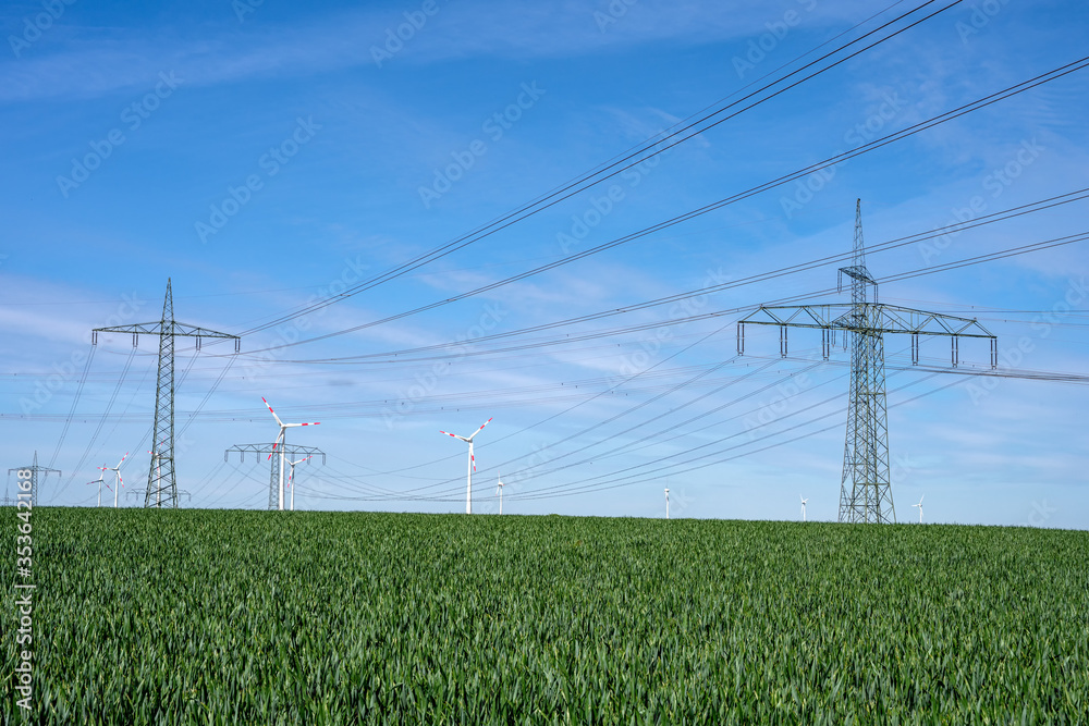 Overhead power lines in a cornfield seen in Germany Overhead power lines in a cornfield seen in Germany