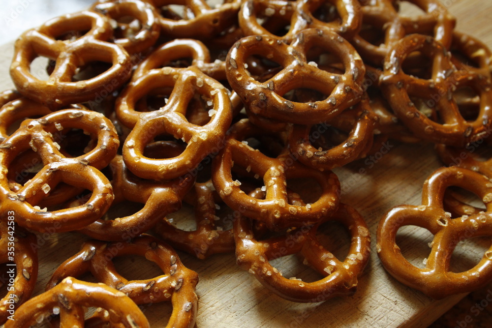 Pretzels Small Salted Mini Twists on a Wooden Board Close Up Pretzels Small Salted Mini Twists on a Wooden Board Close Up