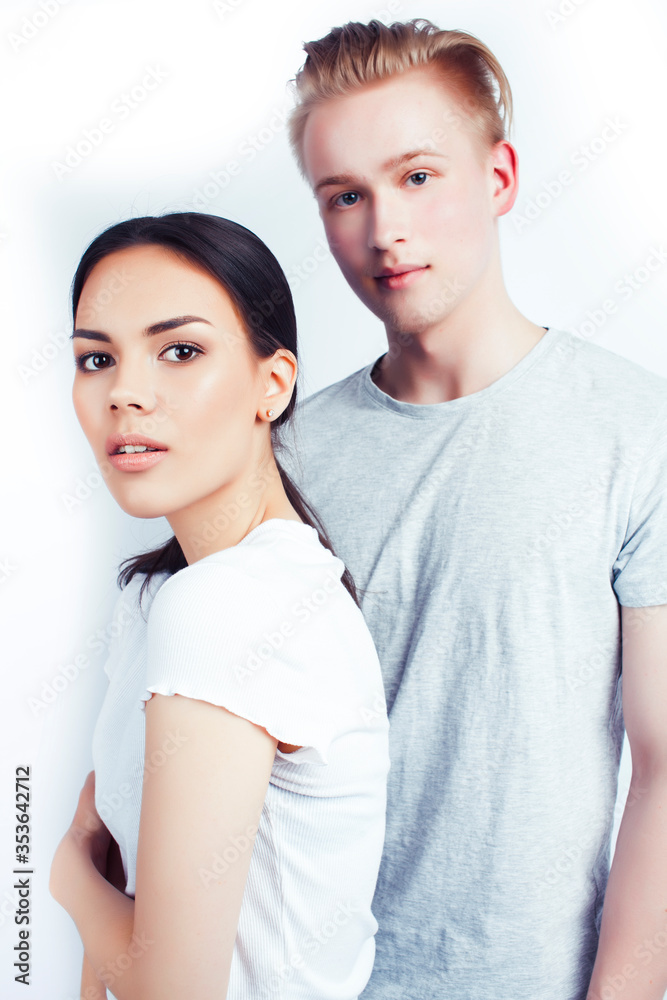 modern hipster guys together couple diverse nations, asian girl and caucasian blond boy isolated on white background, lifestyle people concept modern hipster guys together couple diverse nations, asian girl and caucasian blond boy isolated on white background, lifestyle people concept