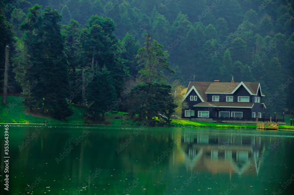 a house by the lake, autumn season
