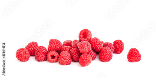 Fresh juicy ripe raspberries on a white background.
