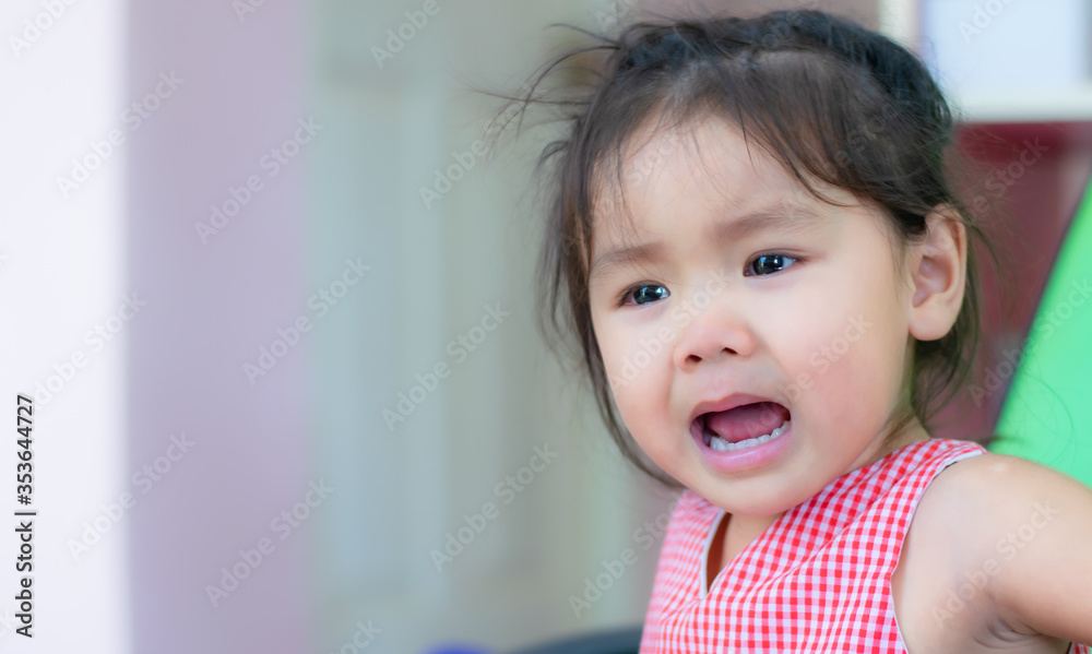 An Asian kindergarten little girl is crying. An Asian kindergarten little girl is crying.