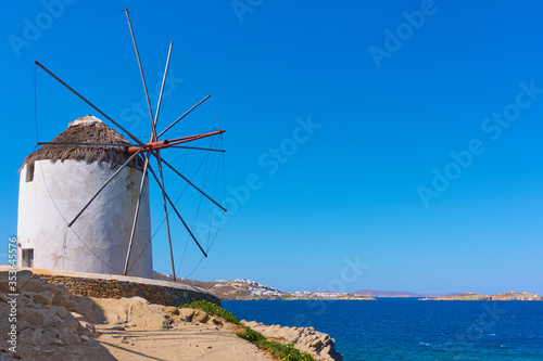 Old white windmilll by the sea in Mykonos