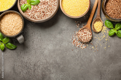 Set with various cereal grains on stone background