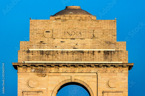 India Gate, New Delhi, India - India Gate is a war memorial built on the eastern end of Rajpath road New Delhi at sunset time. It is the most visited place by tourists & travellers all over the world. photo