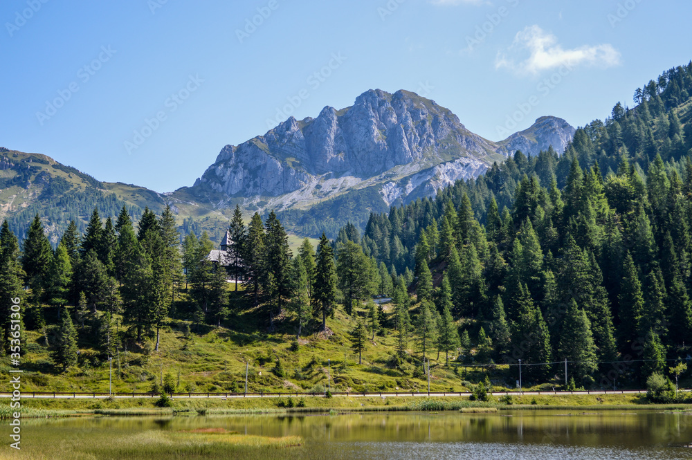 Panoramic view of the Julian Alps in summer, seen from passo Pramollo on the border between Italy and Austria. Mountain Landscape.