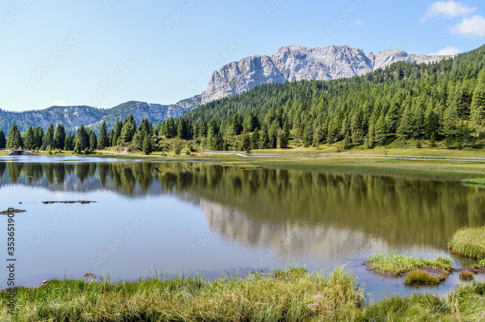 Panoramic view of the Julian Alps in summer, seen from passo Pramollo on the border between Italy and Austria. Mountain Landscape.