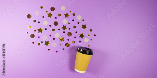 Banner Coffee to go concept. Disposable craft cup with black plastic cover with sparkle glitter confetti on pastel lilac background. Place for text. Flat lay style. Top view