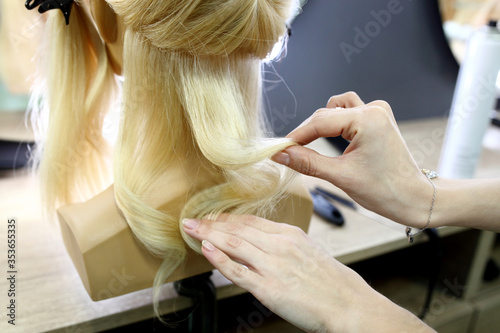 Training hairstyles on a mannequin