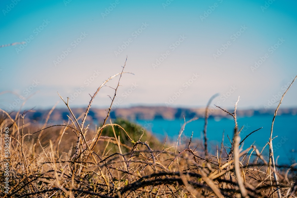 Obraz premium Blurred view of the cliffs of the Brittany coast near the Petit Minou lighthouse near Brest on the Brittany coast in France