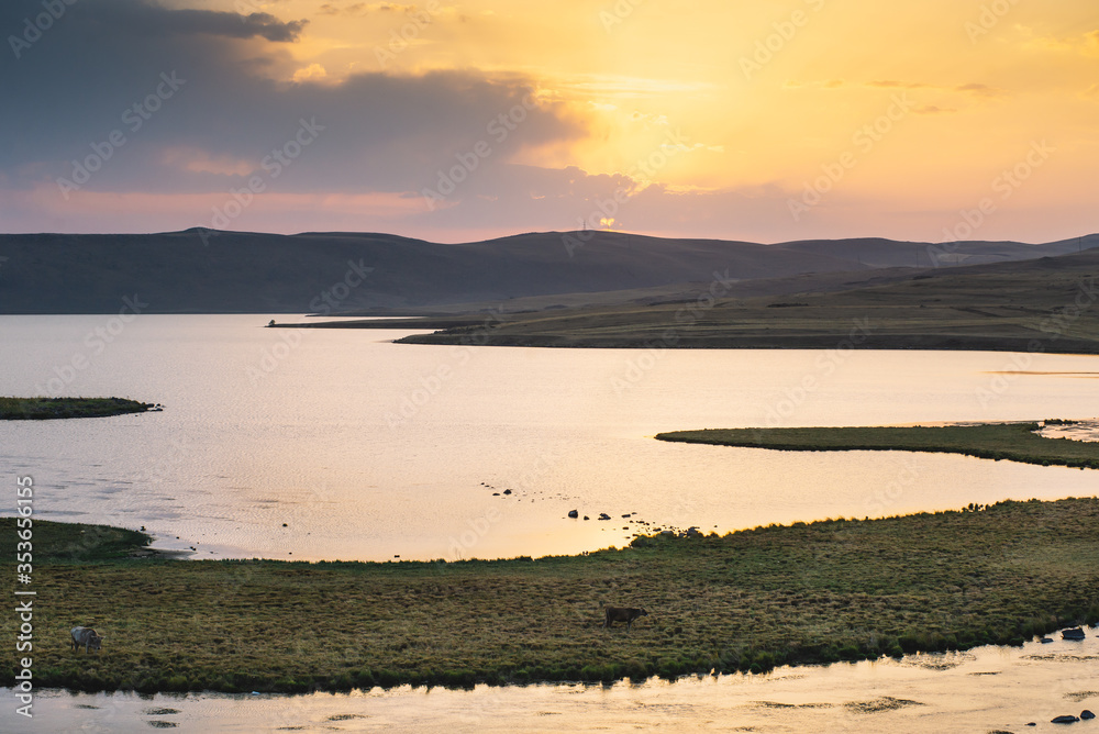 Obraz premium Beautiful Sunset On The Mountain Lake WIth The Little Island Inside