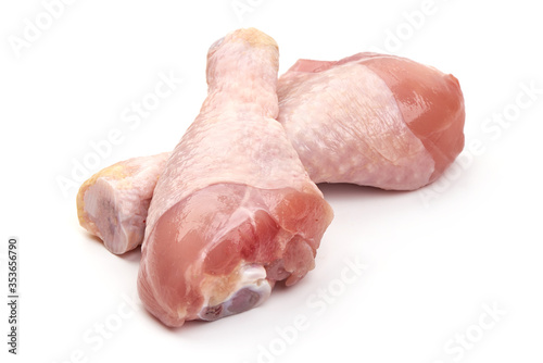 Raw chicken drumsticks, isolated on white background