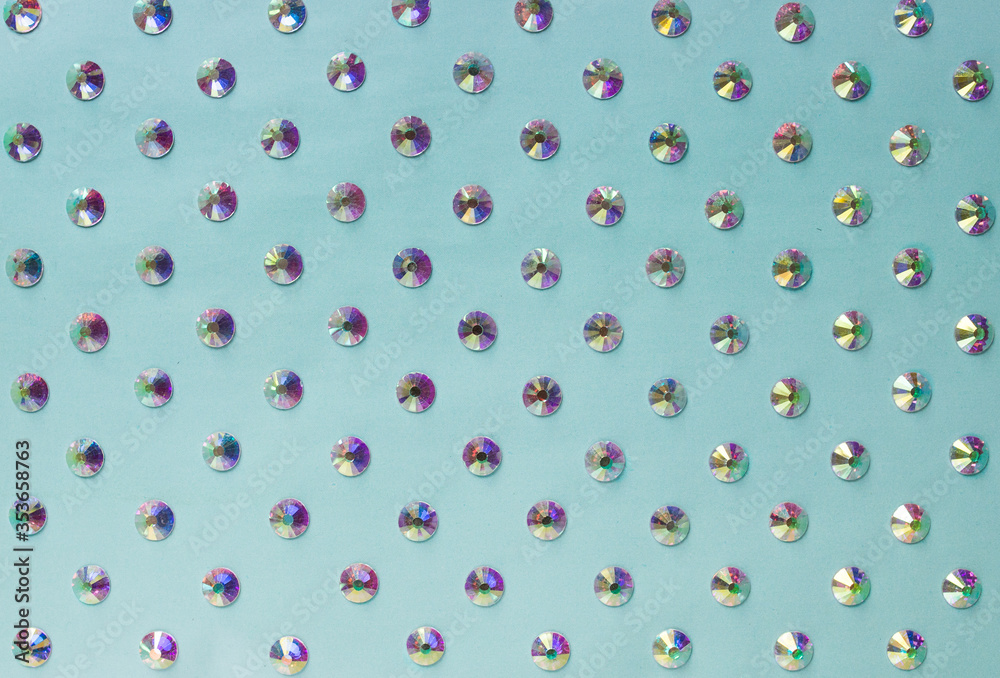 Obraz premium rhinestones on a blue background, top photo. design for text