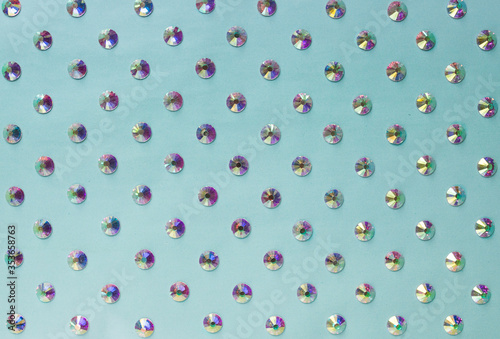 rhinestones on a blue background, top photo. design for text
