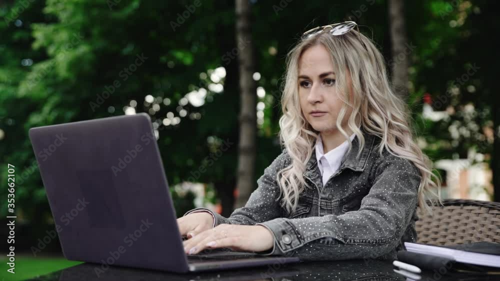 Blonde young businesswoman working on laptop Blonde young businesswoman working on laptop