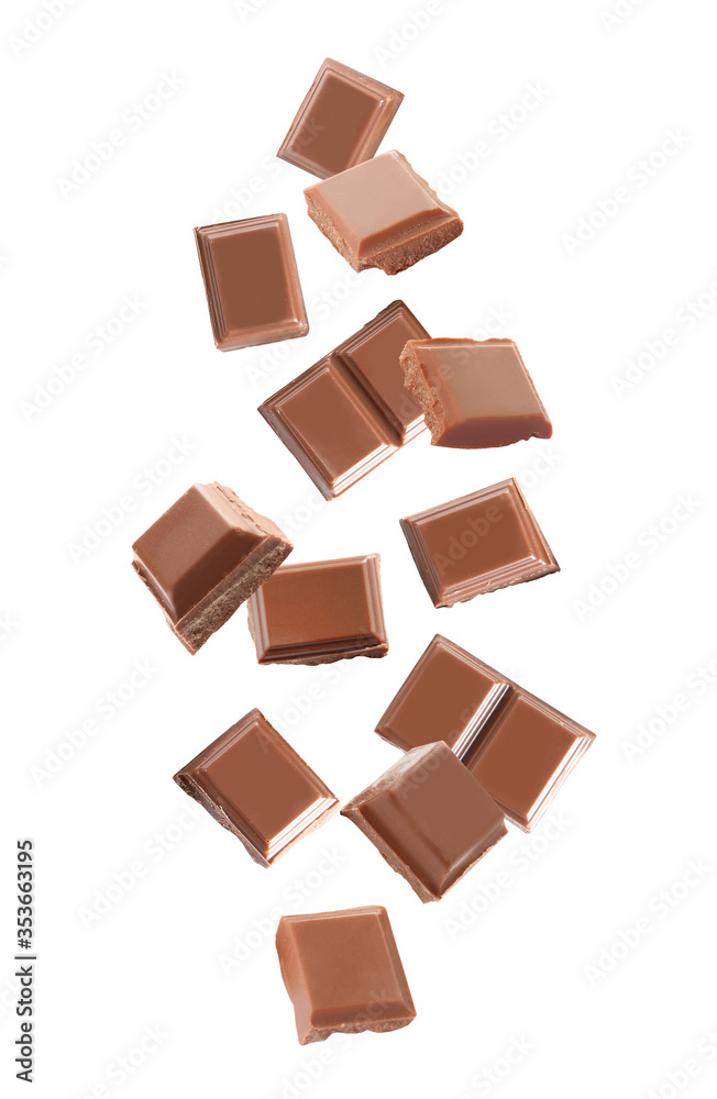 Delicious milk chocolate pieces falling on white background Delicious milk chocolate pieces falling on white background