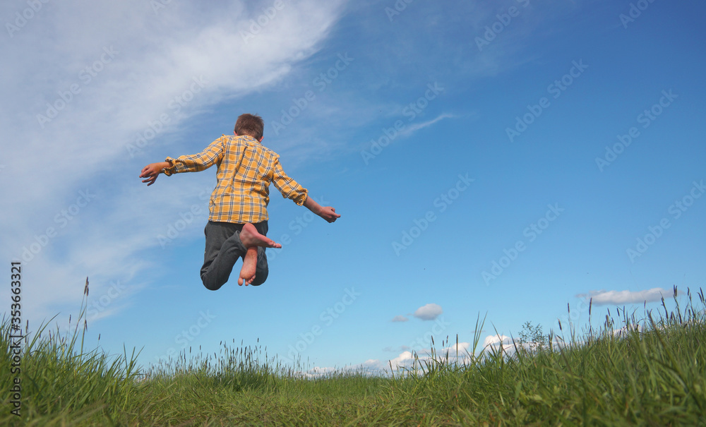 Boy jumps with joy vacation happiness nature and freedom Boy jumps with joy vacation happiness nature and freedom