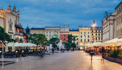 Krakow old town square with outdoor cafes, Poland