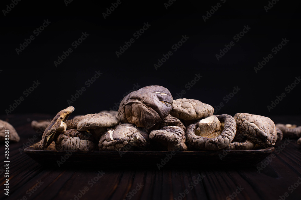 Dried shiitake mushrooms on black background
Dried shiitake mushrooms on black background