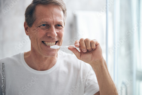 Man taking care of his oral health