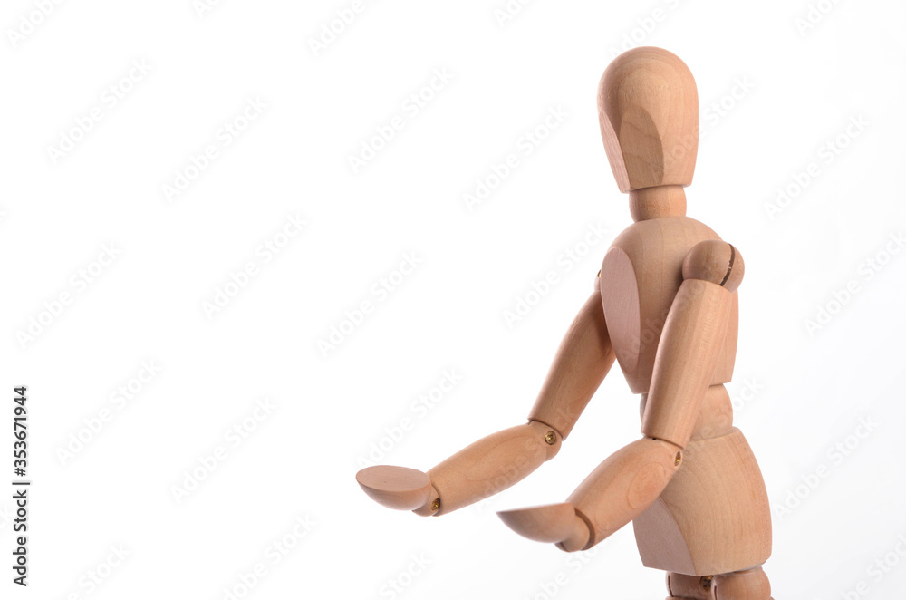 Wooden figure mannequin posing in action isolated on white background. Wooden figure mannequin posing in action isolated on white background.