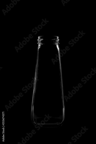 Silhouette of a bottle with a beautiful shape on a black background