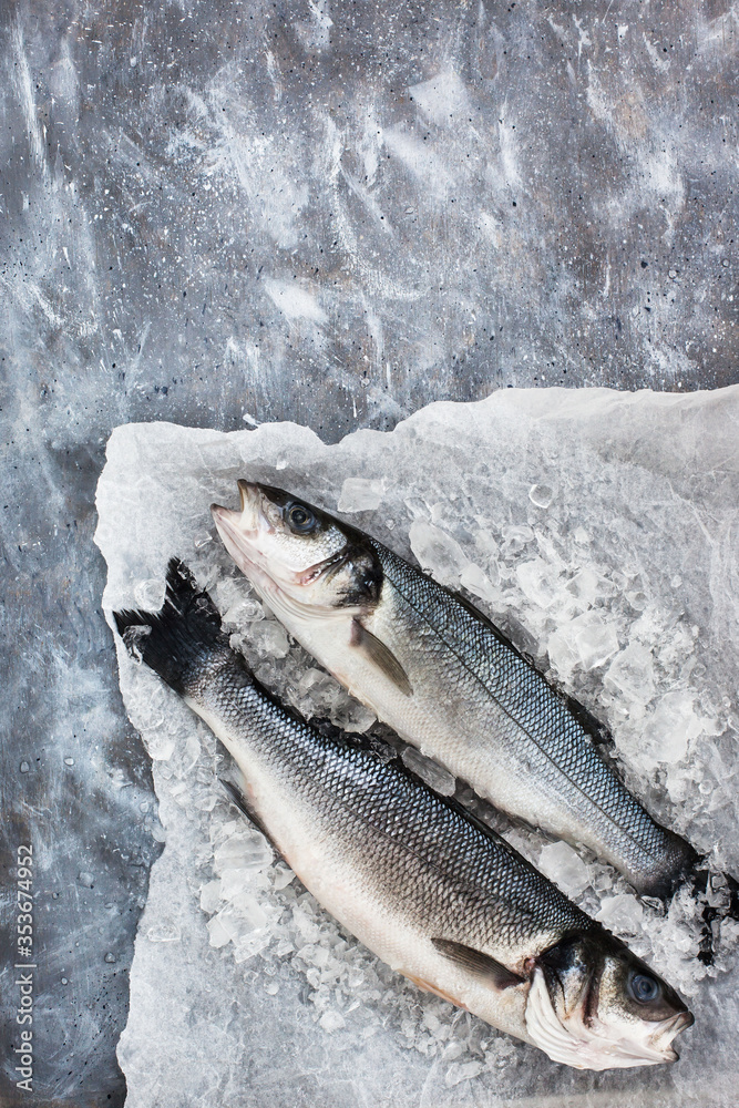 Raw fresh sea bream fish, top view, gray background