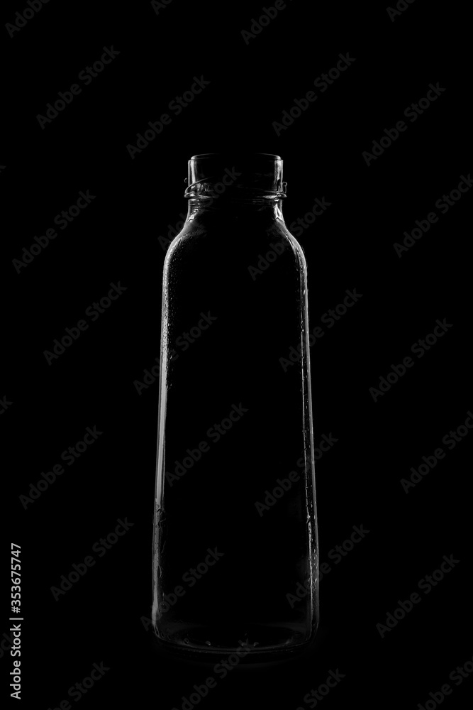 Silhouette of a bottle with a beautiful shape on a black background Silhouette of a bottle with a beautiful shape on a black background