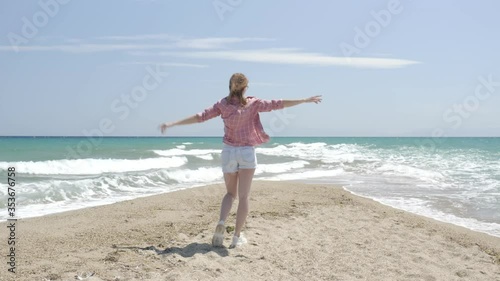Wallpaper Mural Young woman resting at the beach at sunny day Torontodigital.ca