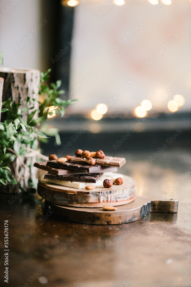 chocolate bars on a Board with nuts chocolate bars on a Board with nuts