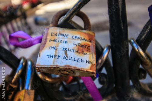 A padlock dedicated to the murdered journalist Daphne Caruana Galizia  on a fence in the centre of Valletta, Malta