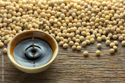 Soy sauce ,Soya, and soybean on wooden background.
