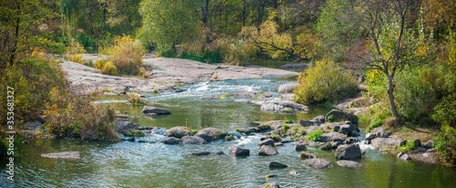 Fototapeta Naklejka Na Ścianę i Meble -  The Ros River in Ukraine crosses the exits of granites of the Archean era in the territory of the park and reserve in the city of Korsun-Shevchenkovsky and flows through the gorge and rapids
