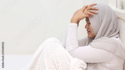 Sad and depressed Asian muslim woman in bed sleepless feeling desperate, worried anxious suffering depression problem and insomnia sleeping disorder