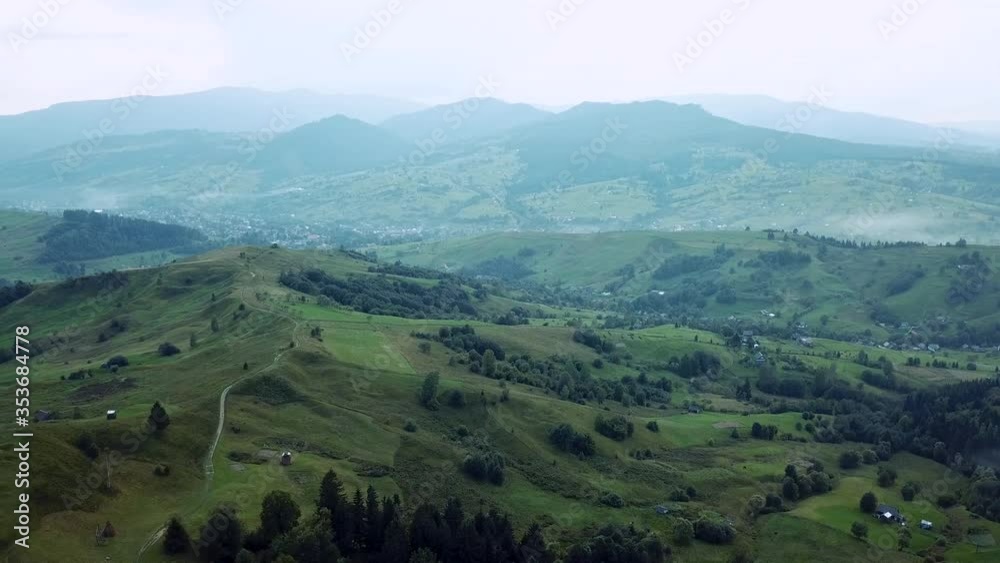 Aerial cinematic view of green forest, mountains and village. drone shot. 4K Aerial cinematic view of green forest, mountains and village. drone shot. 4K