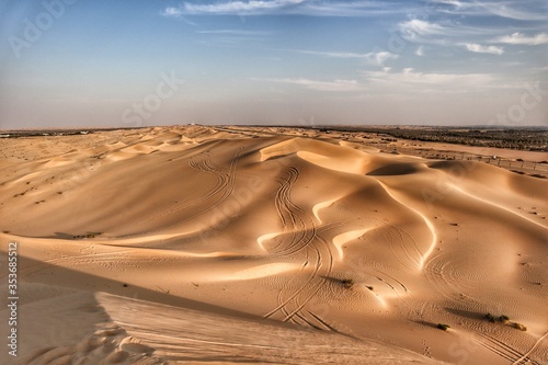 Smooth sand dunes in Al Khateem desert in Abu Dhabi 