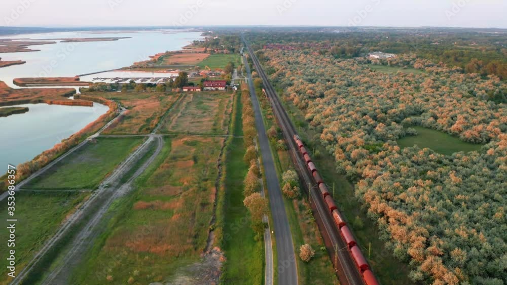 Aerial view of train passing in nature, in Hungary, Europe.