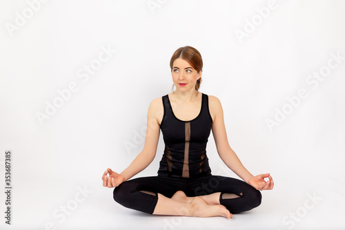 beautiful girl in sports uniform doing sports, on a white background, space for tex