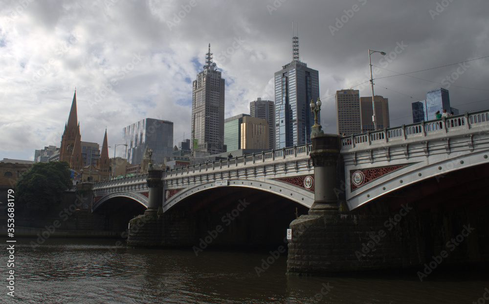 Princess bridge and skycrapers of Melbourne business district at the back