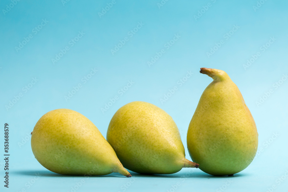 ercolinas pears on blue background ercolinas pears on blue background