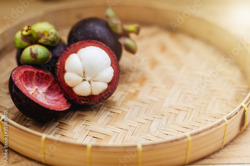 Mangosteen fruit on the woo...