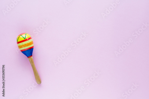 Maracas on pink background for baby toy musical instrument, hobbies, learning and education concept