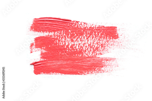 .stain smeared dry brush acrylic red coral color. Isolate on a white background..