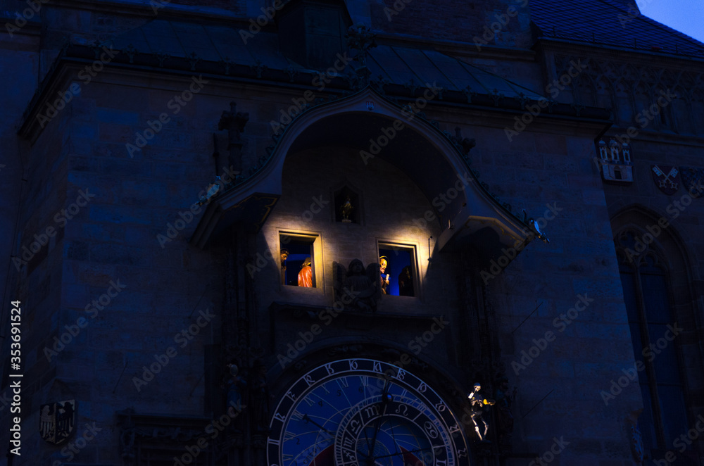 Closeup Prague Astronomical Clock Orloj with small figures located at the medieval Old Town Hall building in Old Town of Prague historical center, evening Prague chimes with figures of 12 apostles