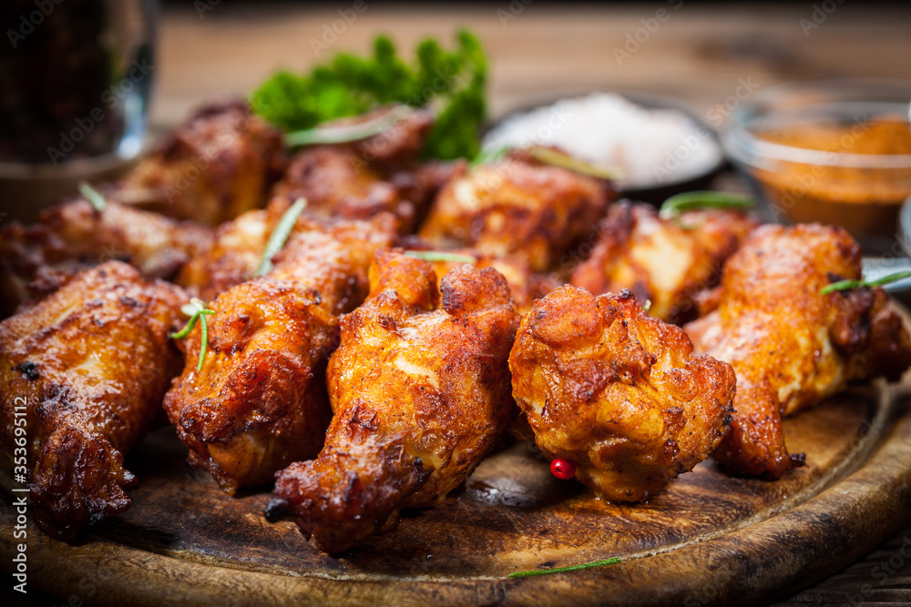 Hot chicken wings with different spices and dips