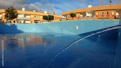 Detail view of a inflowing water jet into a swimming pool with blue tiles. Return inlet in a swimming pool. photo