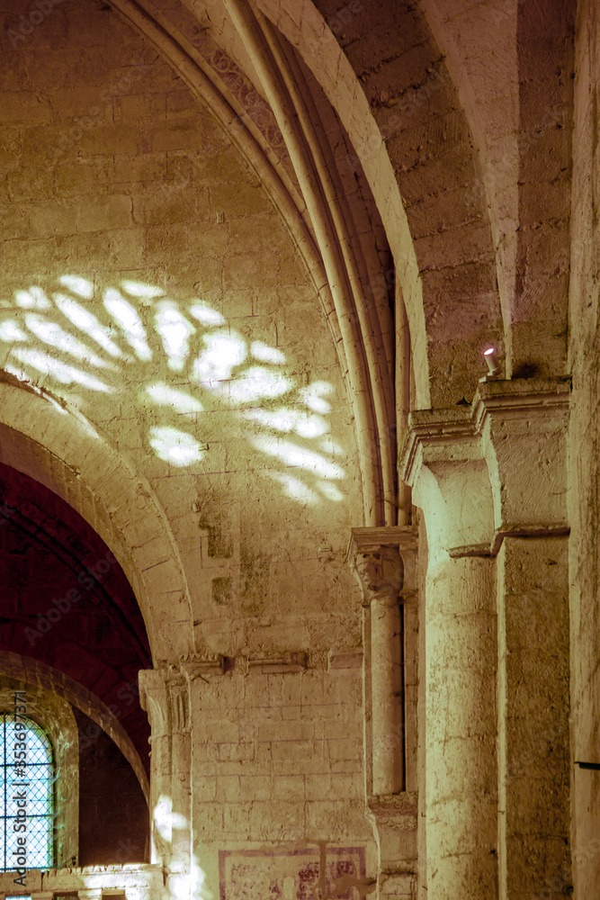 Reflection of the stained glass window of the collegiate church of Saint-Emilion. France