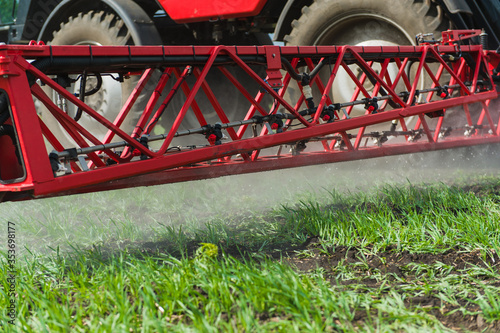 Close up wheels, boom of spray machine